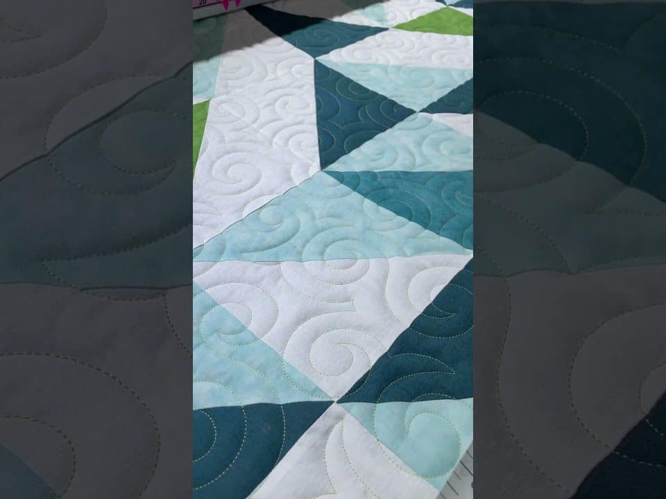 Joyce’s 1/2 HST quilt - Longarm quilted by Maynard Longarm Quilting