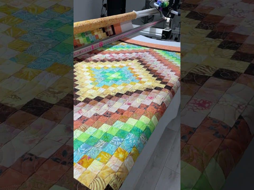 Karen’s Around the Word quilt - Longarm quilted by Maynard Longarm Quilting