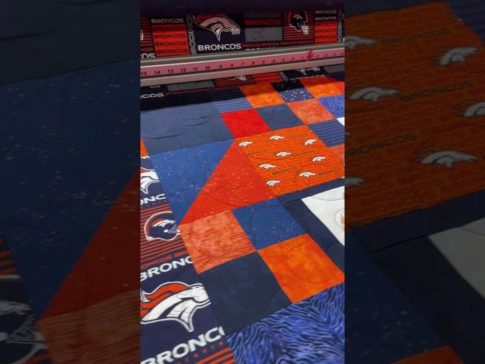 Brenda’s “Bronco’s” quilt - Longarm quilted by Maynard Longarm Quilting