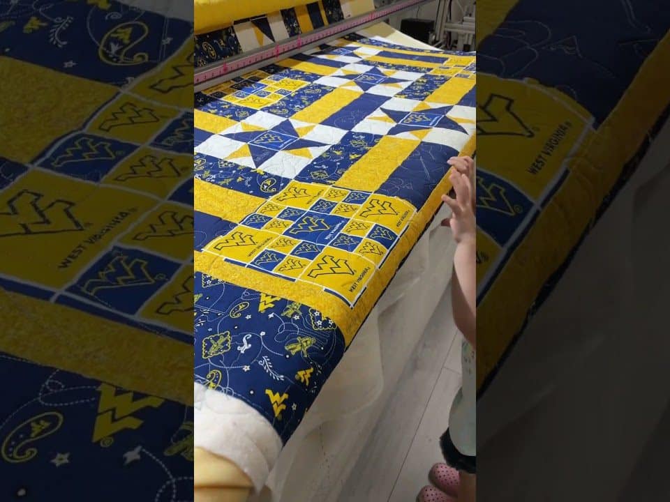 Kathy “WVU” quilt - Longarm quilted by Maynard Longarm Quilting