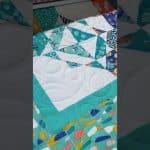 Cathy’s “Wahlah” quilt - Longarm quilted by Maynard Longarm Quilting