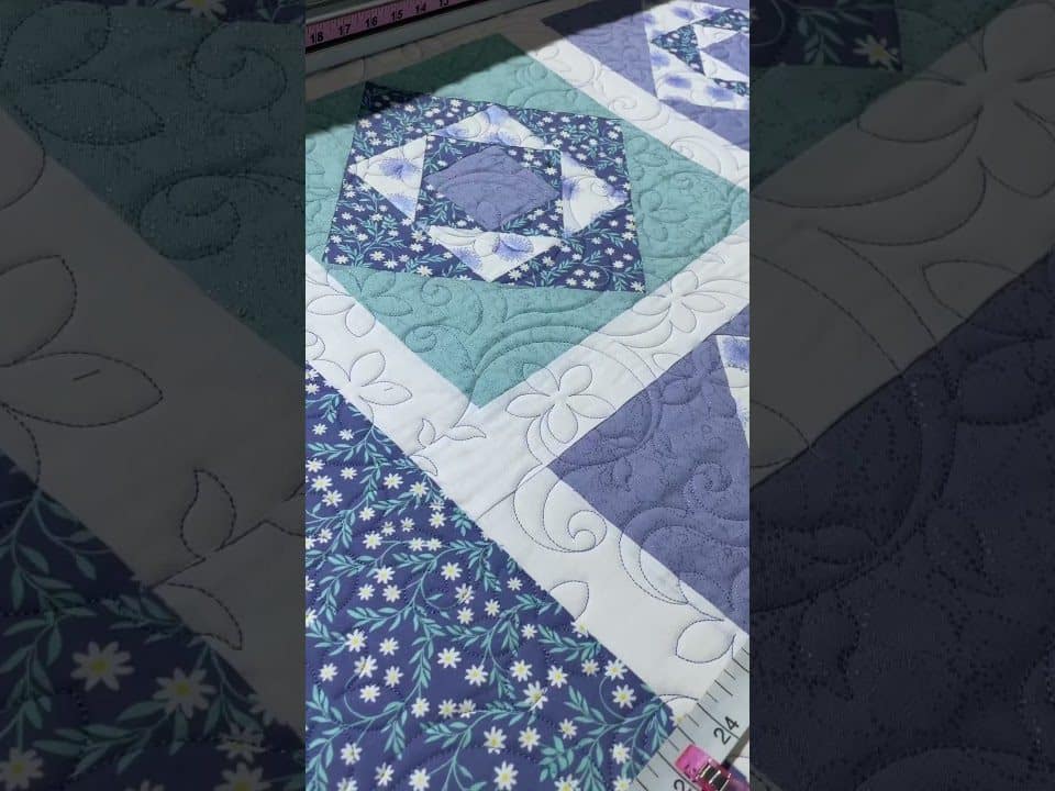 Cindy’s “Periwinkle Daisy” quilt - Longarm quilted by Maynard Longarm Quilting