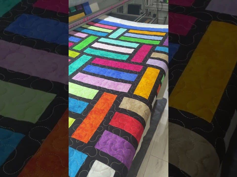 Hope’s “Stained Glass Stripes” quilt - Longarm quilted by Maynard Longarm Quilting