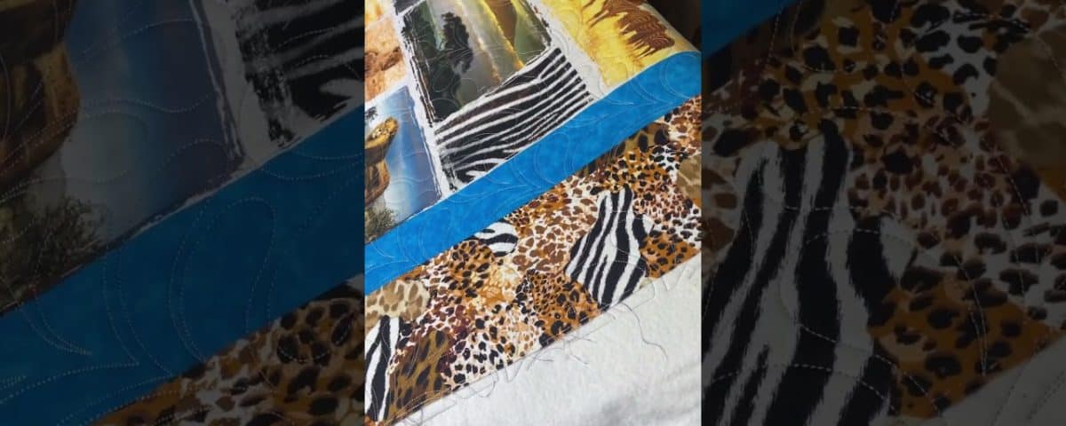 Natalie’s “African Animals” quilt - Longarm quilted by Maynard Longarm Quilting