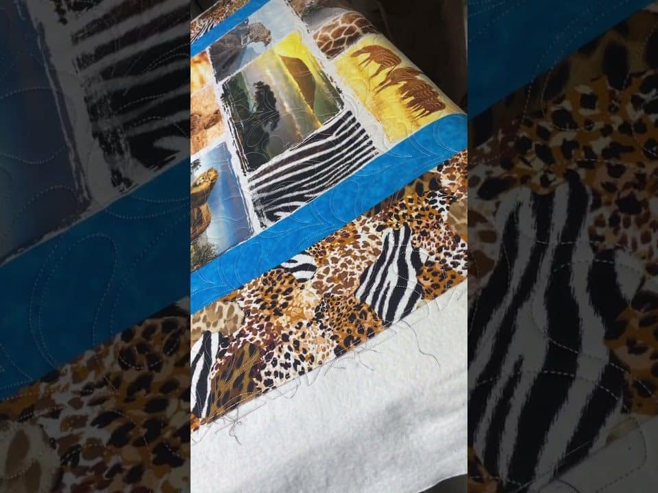 Natalie’s “African Animals” quilt - Longarm quilted by Maynard Longarm Quilting