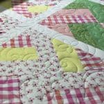 Jaimee’s “Baby Scrappy” quilt - Longarm quilted by Maynard Longarm Quilting