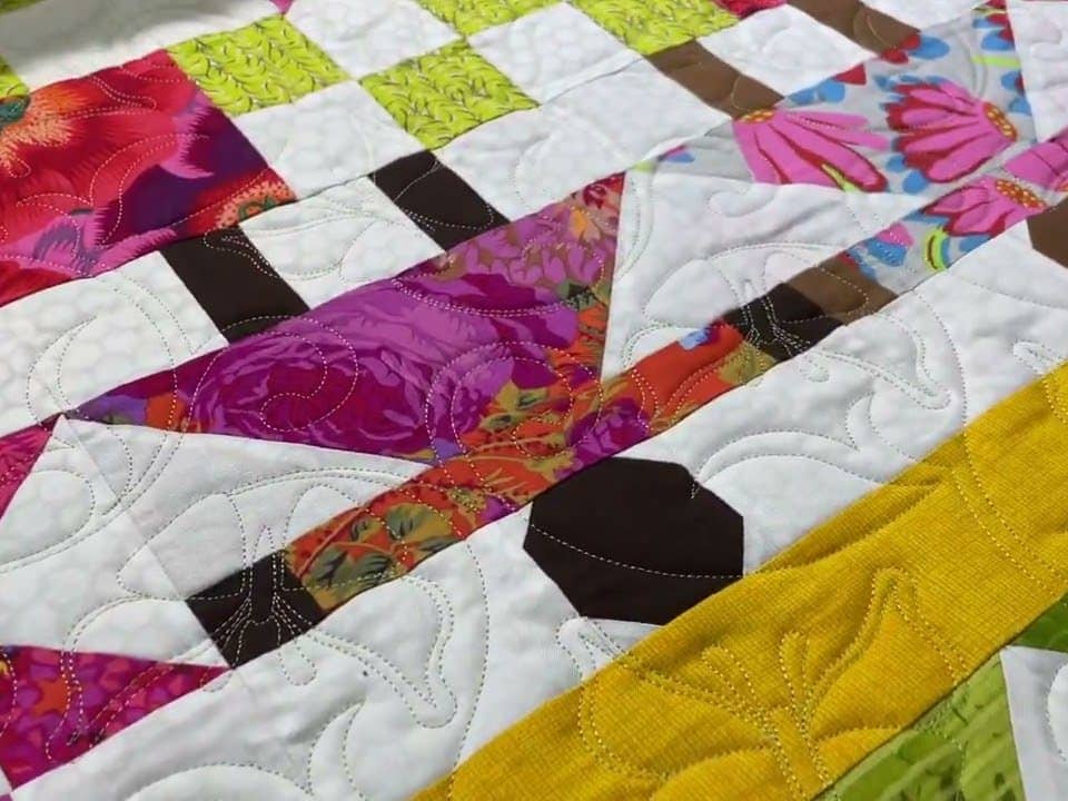Rose’s “House & People” quilt - Longarm quilted by Maynard Longarm Quilting