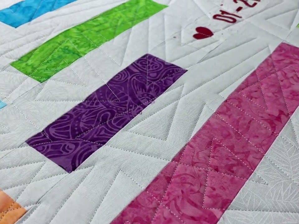 Hope’s “Anniversary” quilt - Longarm quilted by Maynard Longarm Quilting