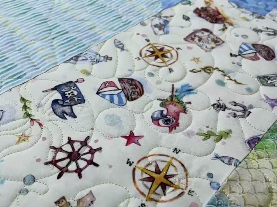 Helen’s “Enchanted Seas” quilt - Longarm quilted by Maynard Longarm Quilting