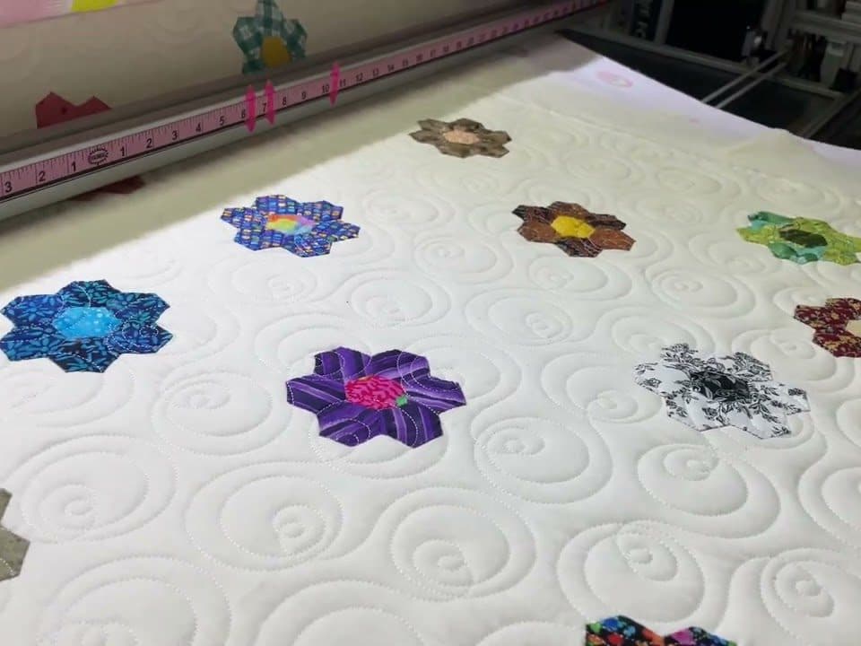 Eleanor’s “Hexy Flowers” quilt - Longarm quilted by Maynard Longarm Quilting