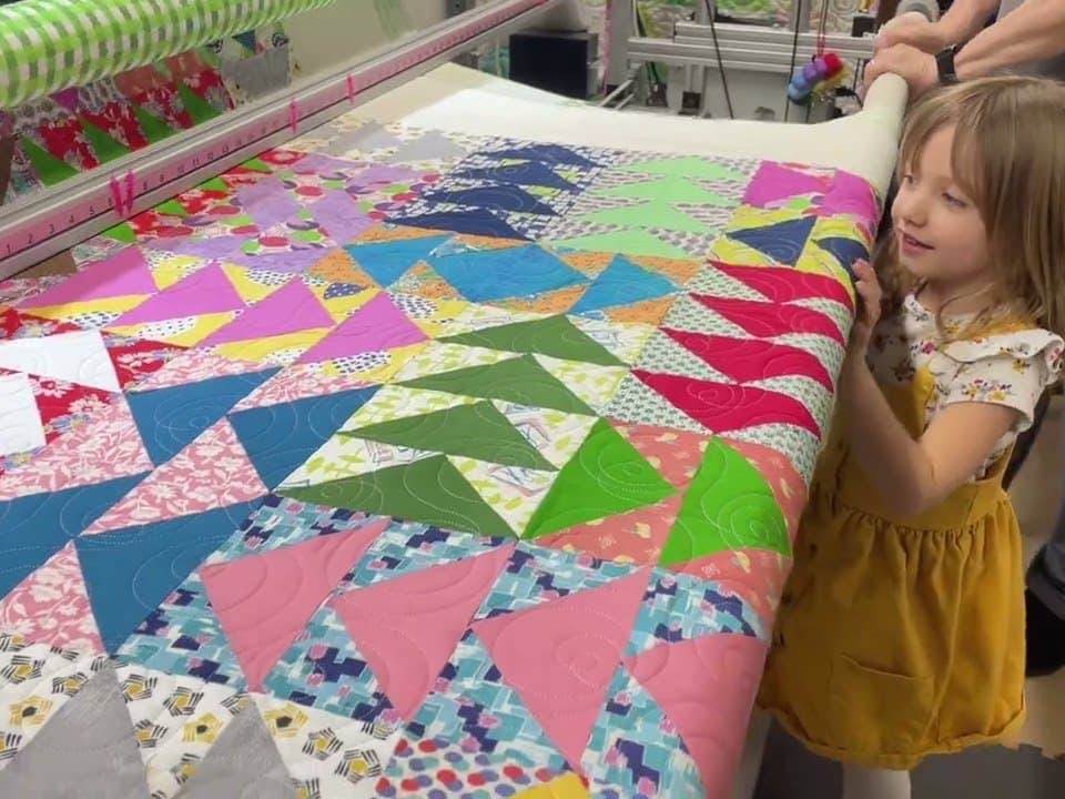 Justine’s “Scrappy Flying Geese” quilt - Longarm quilted by Maynard Longarm Quilting