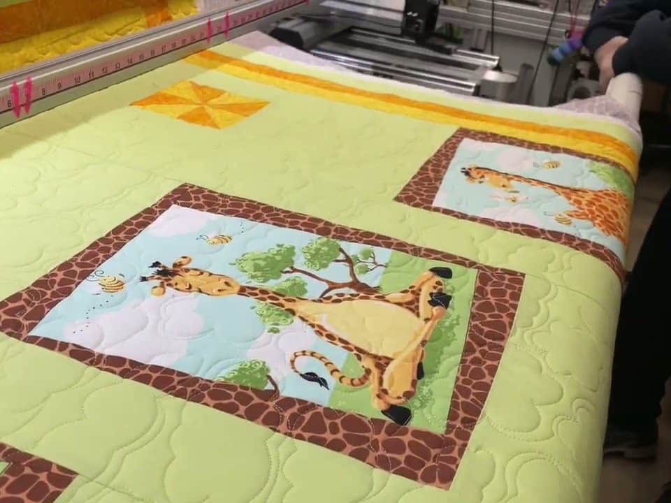 Sandy’s “Baby giraffe” quilt - Longarm quilted by Maynard Longarm Quilting