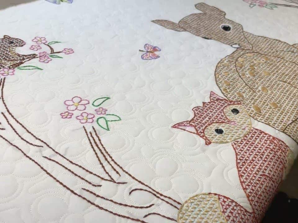Delores’s “Crossed-stitch Animal” quilt - Longarm quilted by Maynard Longarm Quilting