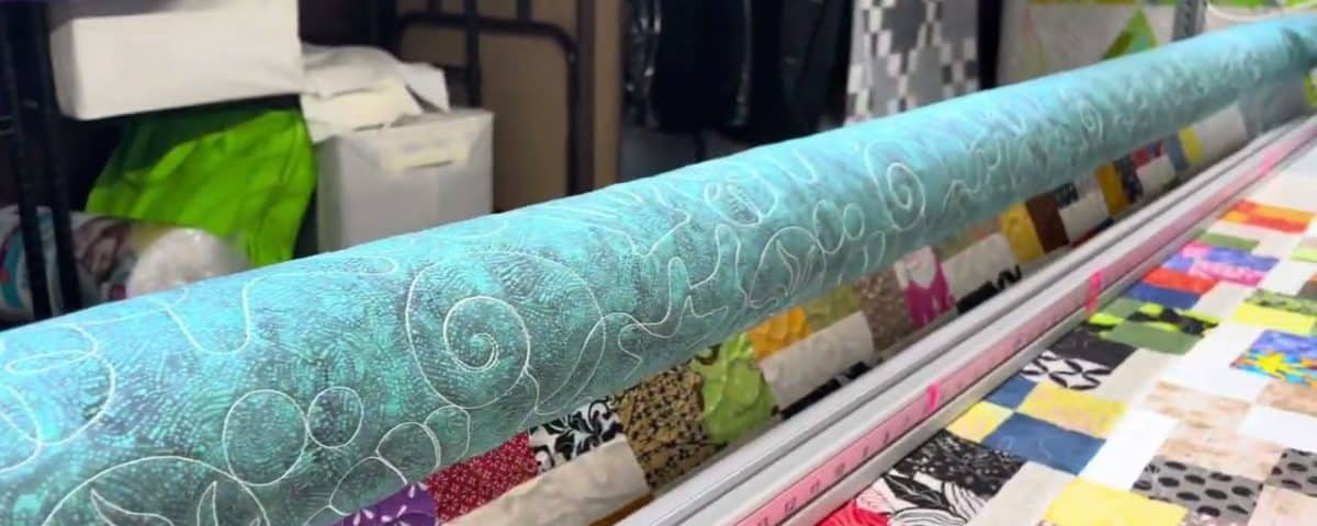 Vicki’s “Scrappy 4-Patch” - Longarm quilted by Maynard Longarm Quilting