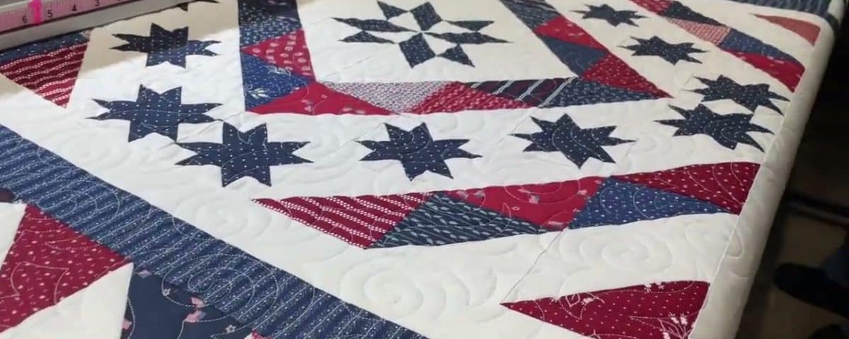 Karen’s husband’s “QOV” quilt - Longarm quilted by Maynard Longarm Quilting