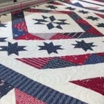 Karen’s husband’s “QOV” quilt - Longarm quilted by Maynard Longarm Quilting