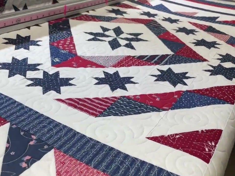 Karen’s husband’s “QOV” quilt - Longarm quilted by Maynard Longarm Quilting