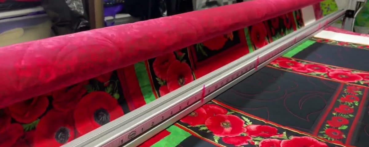 Carol B’s “Poppies” quilt - Longarm quilted by Maynard Longarm Quilting