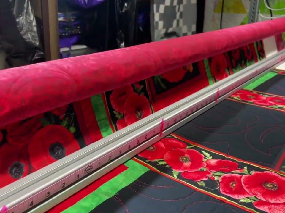 Carol B’s “Poppies” quilt - Longarm quilted by Maynard Longarm Quilting