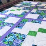 Hope’s “Disappearing 9-patch” hydrangea quilt - Longarm quilted by Maynard Longarm Quilting