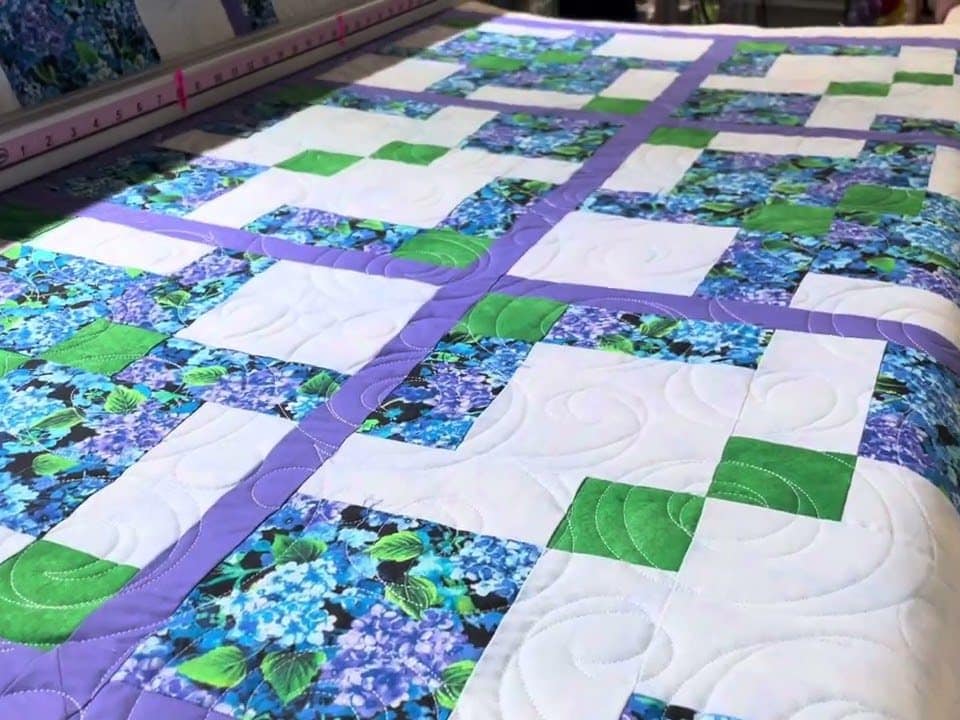 Hope’s “Disappearing 9-patch” hydrangea quilt - Longarm quilted by Maynard Longarm Quilting