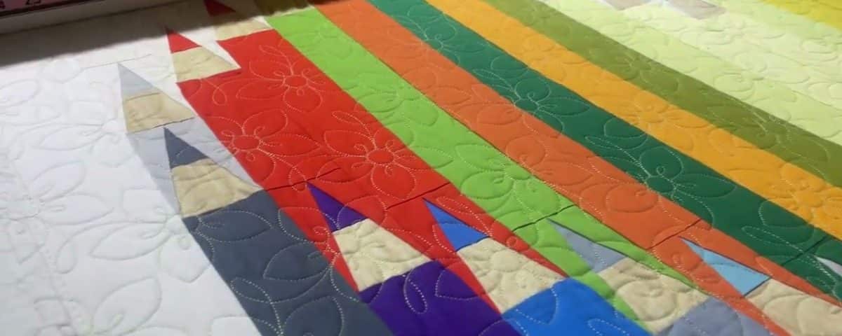 Eileen’s “Color My World” paper pieced quilt - Longarm quilted by Maynard Longarm Quilting