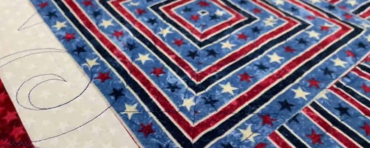 Rosalie’s “QOV” quilt for her hubby - Longarm quilted by Maynard Longarm Quilting