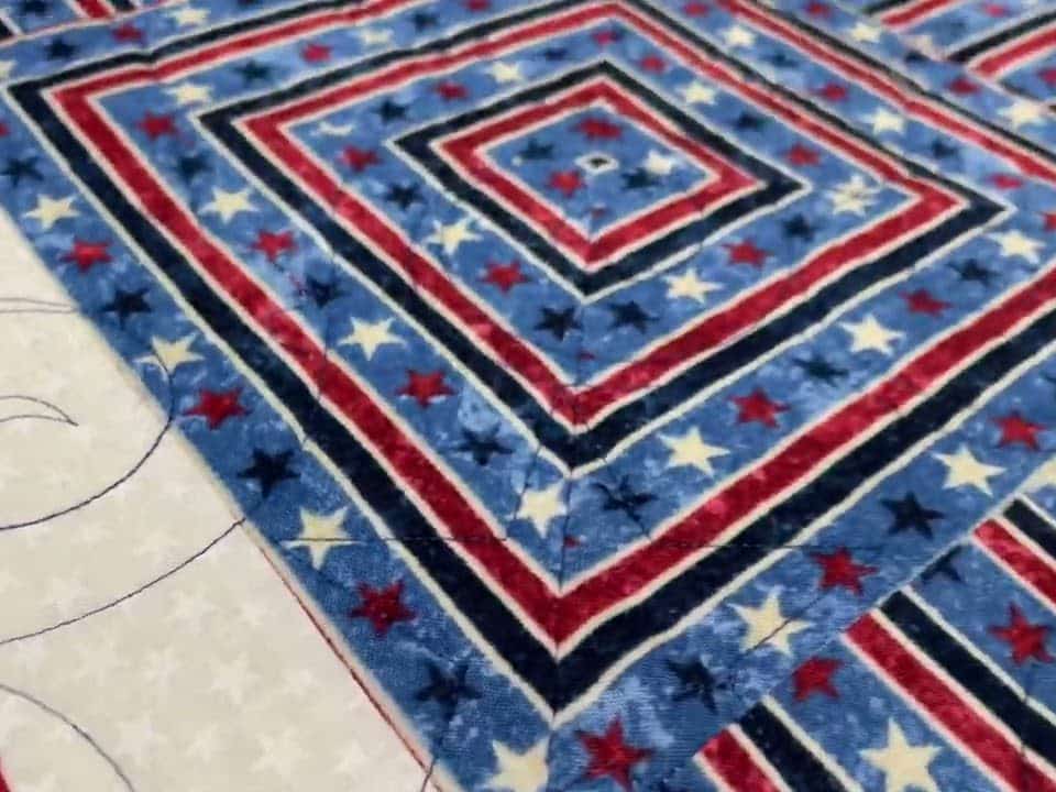 Rosalie’s “QOV” quilt for her hubby - Longarm quilted by Maynard Longarm Quilting