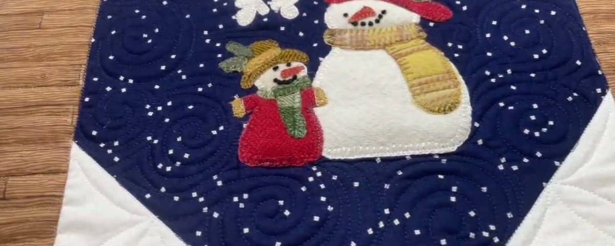 Brenda’s “Woolie Snowman” quilt - Longarm quilted by Maynard Longarm Quilting