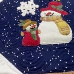 Brenda’s “Woolie Snowman” quilt - Longarm quilted by Maynard Longarm Quilting