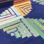 Leslie’s “Puzzazzle” quilt - Longarm quilted by Maynard Longarm Quilting