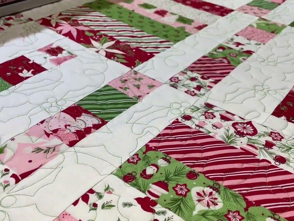 Carol’s “Wrapping Party” quilt - Longarm quilted by Maynard Longarm Quilting