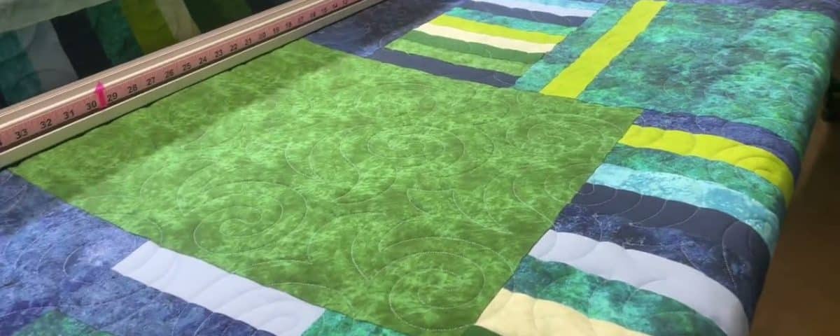 Sandra’s “Muted Blues & Greens” quilt - Longarm quilted by Maynard Longarm Quilting
