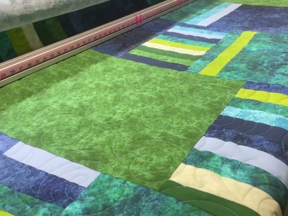 Sandra’s “Muted Blues & Greens” quilt - Longarm quilted by Maynard Longarm Quilting