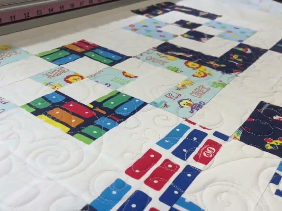 Edie’s “Fisher Price” Quilt - Longarm quilted by Maynard Longarm Quilting