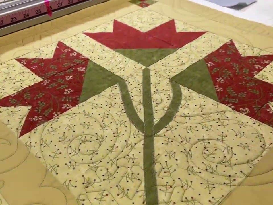 Edie’s “Christmas BOM” quilt - Longarm quilted by Maynard Longarm Quilting