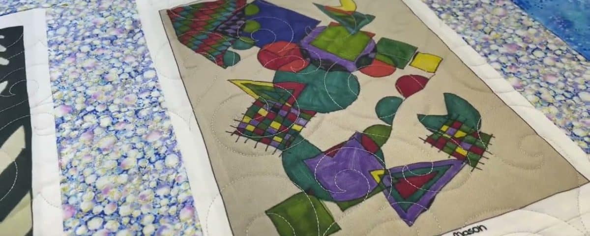 Bette’s “Artwork Panel” quilt - Longarm quilted by Maynard Longarm Quilting