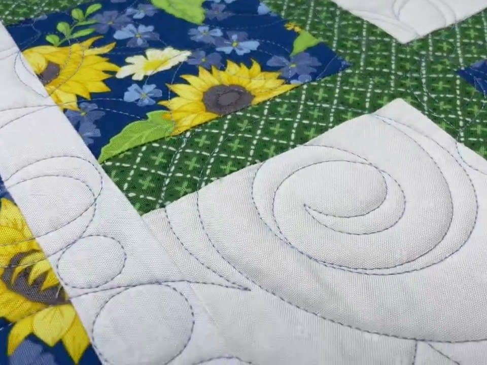 Hope’s “Spring Flowers” quilt - Longarm quilted by Maynard Longarm Quilting