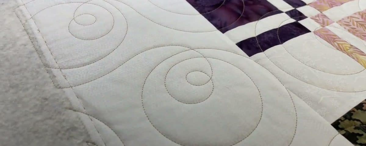 Leslie’s “Disappearing 4-Patch” quilt - Longarm quilted by Maynard Longarm Quilting