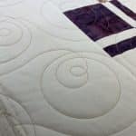 Leslie’s “Disappearing 4-Patch” quilt - Longarm quilted by Maynard Longarm Quilting