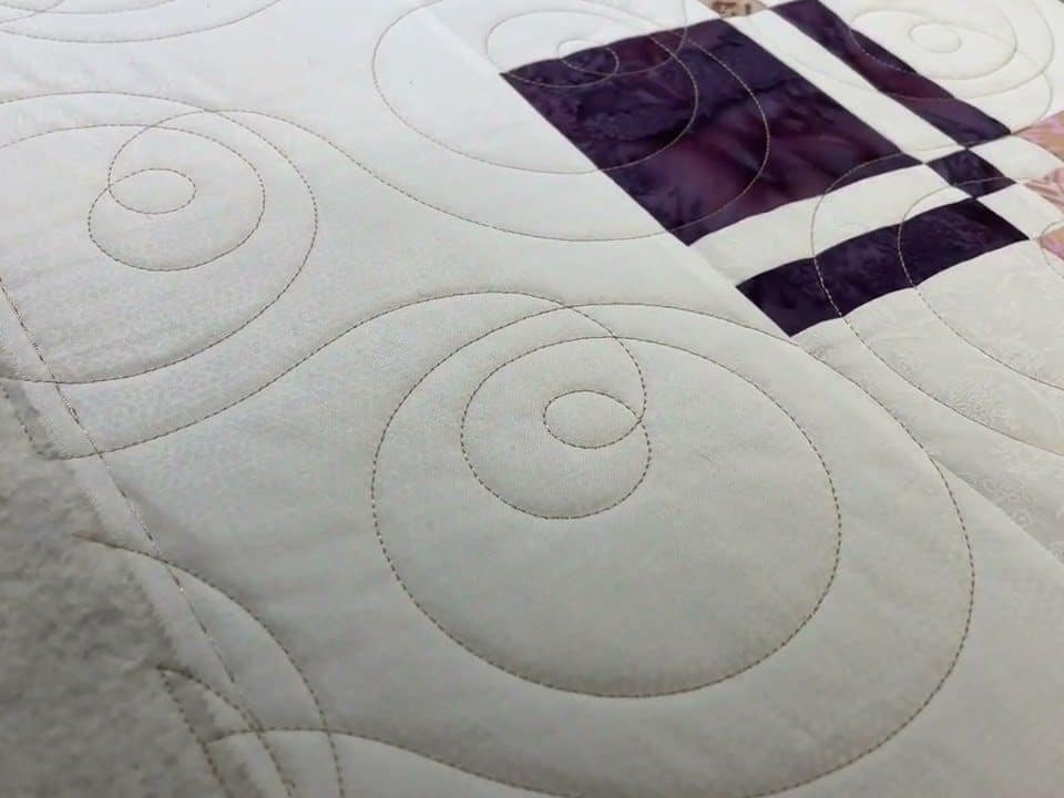 Leslie’s “Disappearing 4-Patch” quilt - Longarm quilted by Maynard Longarm Quilting