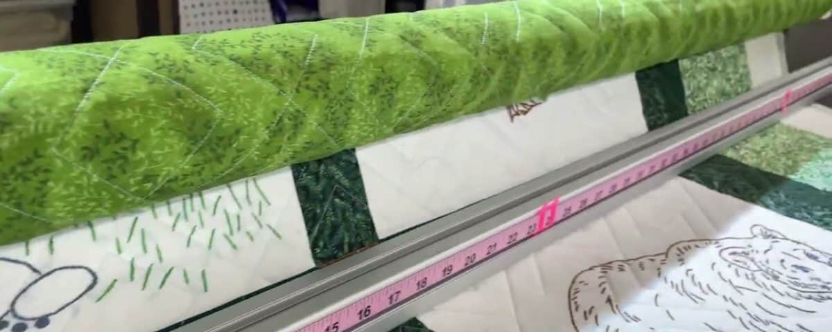Michele’s “Woodsy Embroidered” quilt - Longarm quilted by Maynard Longarm Quilting