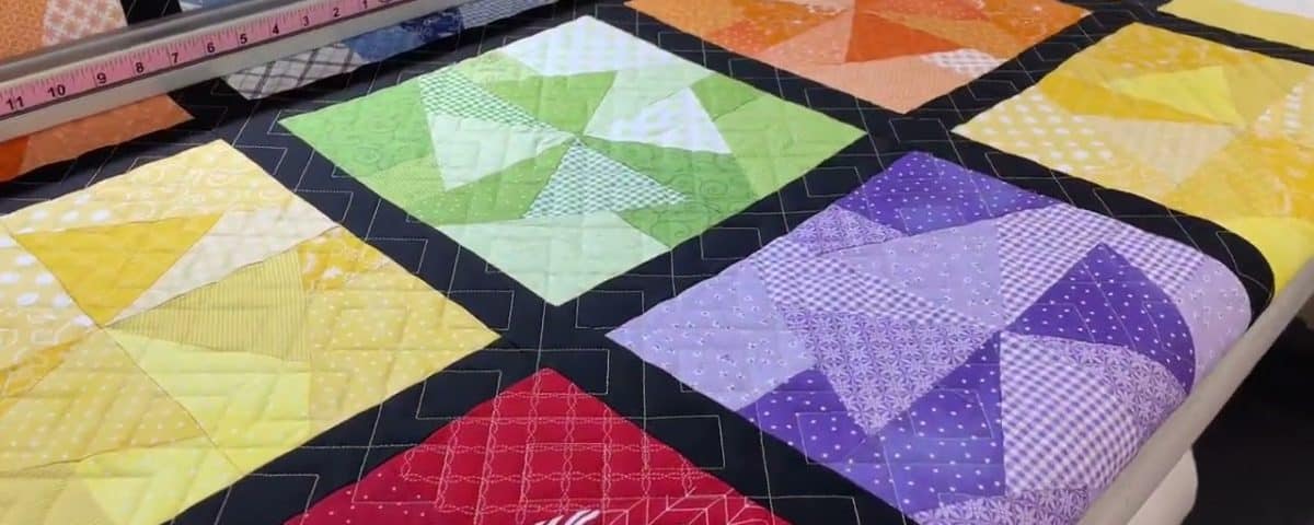 Hope’s “Scrappy Pinwheel” quilt - Longarm quilted by Maynard Longarm Quilting