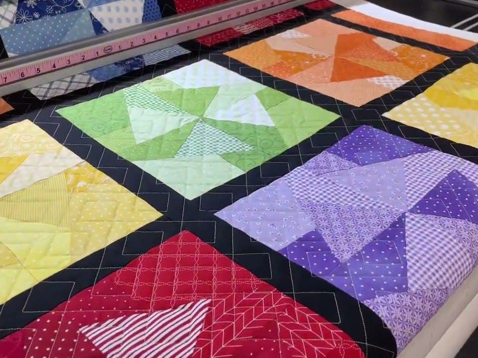 Hope’s “Scrappy Pinwheel” quilt - Longarm quilted by Maynard Longarm Quilting
