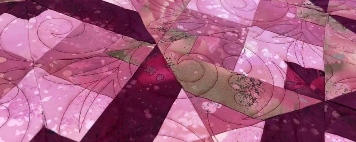 Hope’s “Maroon” quilt - Longarm quilted by Maynard Longarm Quilting