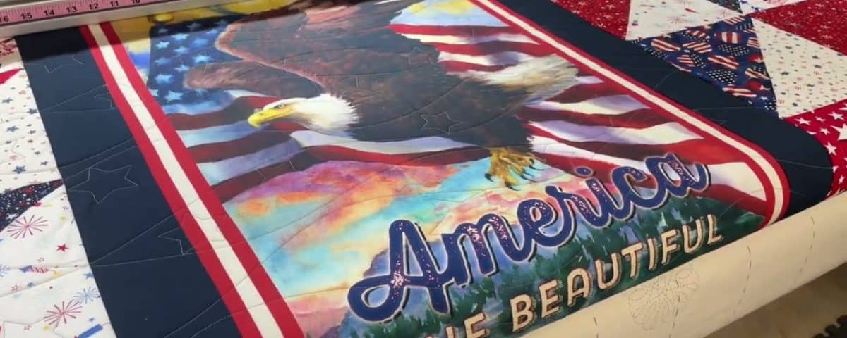 Barb’s “America the Beautiful” panel quilt - Longarm quilted by Maynard Longarm Quilting