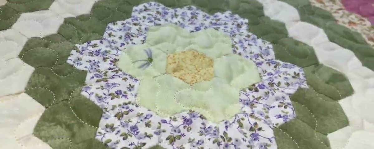 Cathie’s “Grandmother’s Garden” quilt - Longarm quilted by Maynard Longarm Quilting