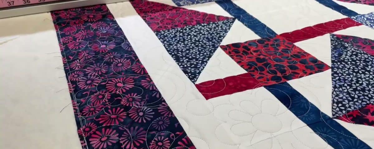 Karen’s “QOV” quilt - Longarm quilted by Maynard Longarm Quilting