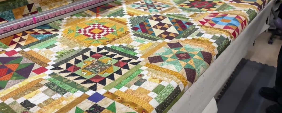 Leslie’s “Saturday Sampler-BOM” quilt - Longarm quilted by Maynard Longarm Quilting