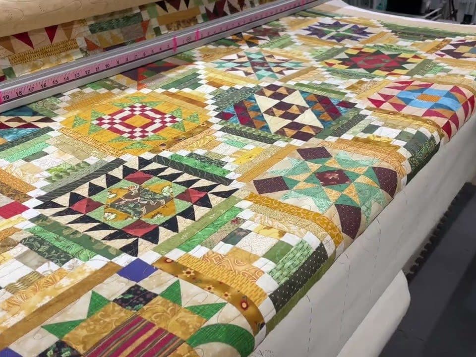 Leslie’s “Saturday Sampler-BOM” quilt - Longarm quilted by Maynard Longarm Quilting